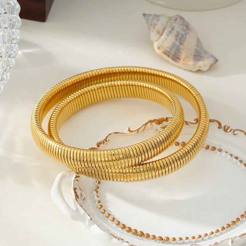 Double snake bangle gold